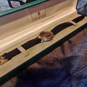 Gucci Men's Watch with Black Strap and Gold Accents